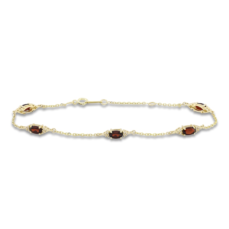 Main Image 1 of Oval-Cut Natural Garnet & Diamond Station Bracelet 1/15 ct tw 10K Yellow Gold 7.25&quot;