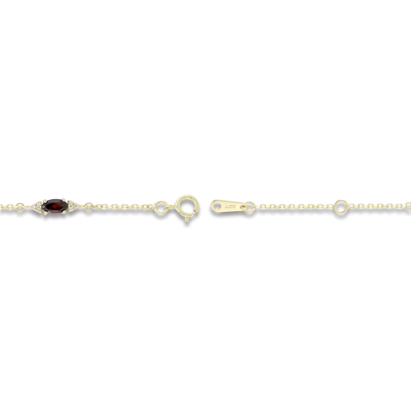 Main Image 2 of Oval-Cut Natural Garnet & Diamond Station Bracelet 1/15 ct tw 10K Yellow Gold 7.25&quot;